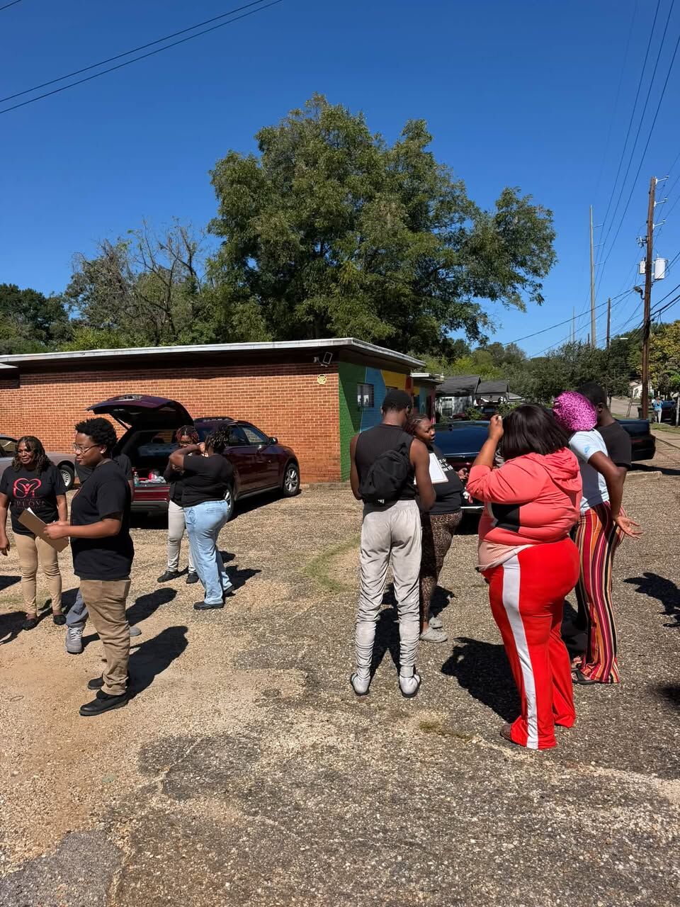 Community members and volunteers gathered at the giveaway