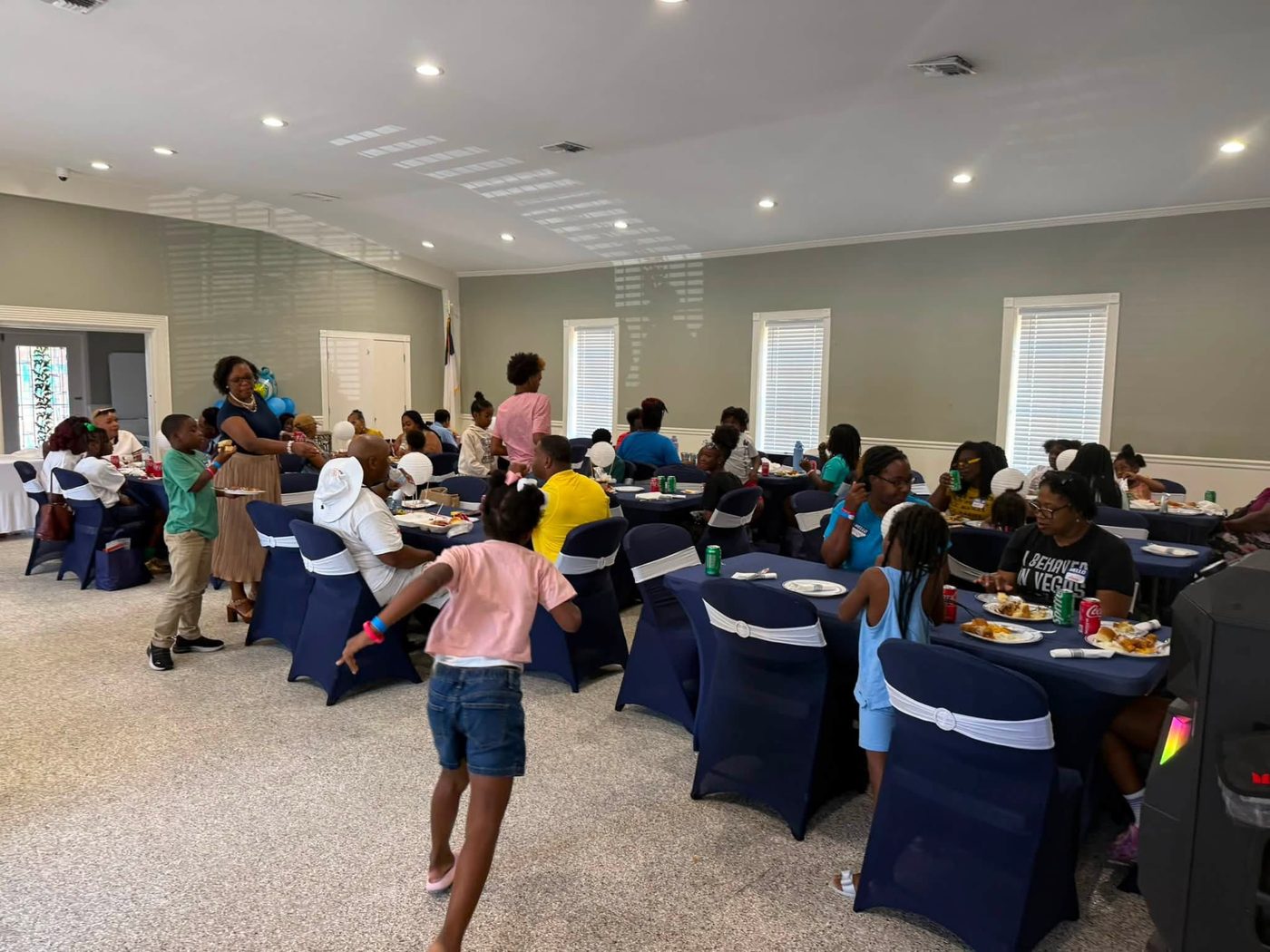 Guests seated at banquet tables enjoying the meal before the mental health summit